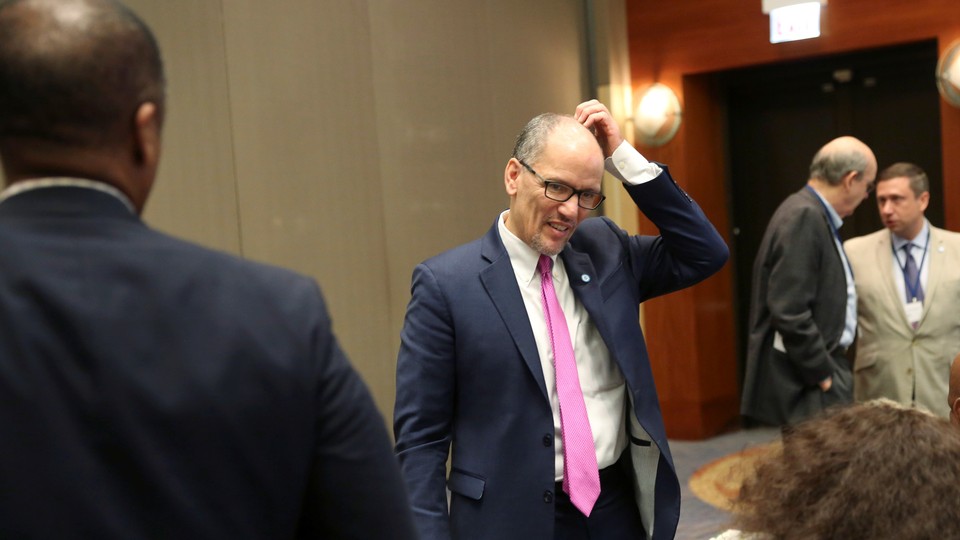 Democratic National Committee Chairman Tom Perez scratches his head.