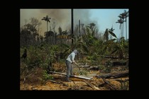 BRAZIL. 2019. Edmar, a worker on a small farm in the Victoria settlement, clears away brush in an effort to contain fires.