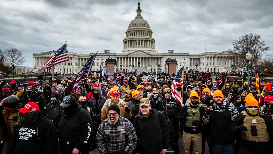 Color photograph of protesters gathered outside the U.S. Capitol Building.