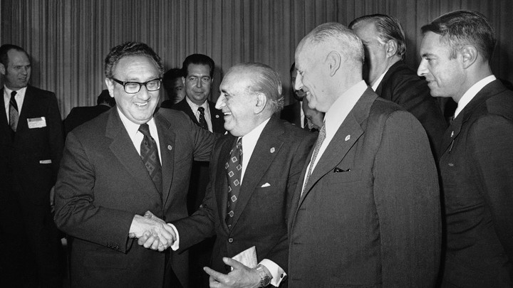 U.S. Secretary of State Henry Kissinger greets Argentina's Foreign Minister, Alberto J. Vignes, as Ismael Huerta Diaz, right, foreign ministers of Chile, looks on during break in Latin Foreign Ministers Conference in Mexico City, Feb. 22, 1974.