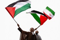 Two Iranian clerics wave Iranian and Palestinian flags at an anti-Israel rally in Tehran.