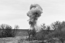 Cloud of dust and debris from an explosive