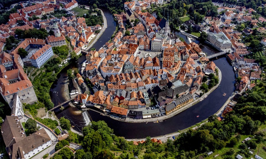 An elevated view of an older European town surrounded by a bending river
