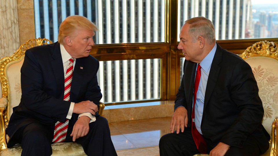 Israeli Prime Minister Benjamin Netanyahu speaks to Republican U.S. presidential candidate Donald Trump during their meeting in New York on September 25, 2016.