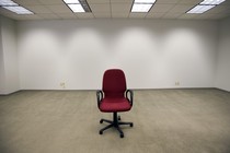 An office chair sitting in an empty room