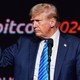 trump with bitcoin sign in the background