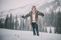 Billy Barr stands in the snow at his home below Gothic Mountain
