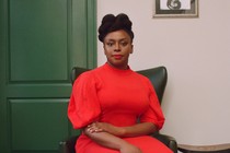 Photo of Chimananda Ngozie Adichie wearing a red dress
