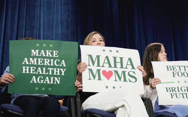 An image of three women holding pro-MAHA signs.