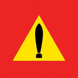 Triangular yellow road sign, but the exclamation mark looks like a launching missile