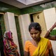 Women waiting to use a community toilet in India