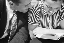 a man and woman reading