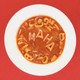 A bowl of tomato soup in which noodles spell out "MAHA," next to a blue plastic spoon