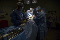 Surgeons work on a patient at Dr. Isaac Gonzalez Martínez Oncological Hospital in San Juan.