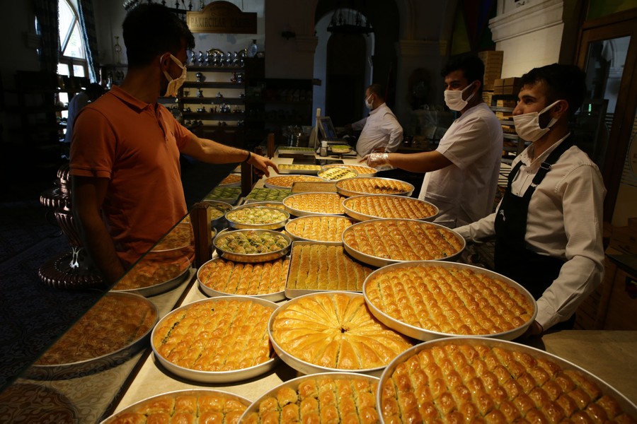 Trays of baklava are seen in a bakery.