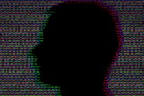 A man's silhouette in front of a background made up of repeating zeroes and ones
