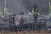 A line chart superimposed over an atmospheric photo of an oil refinery