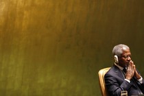 Annan sits with headphones as he listens to George W. Bush at the UN General Assembly in 2006.