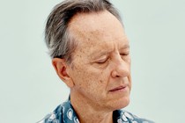 Portrait of the actor Richard E. Grant with his eyes closed