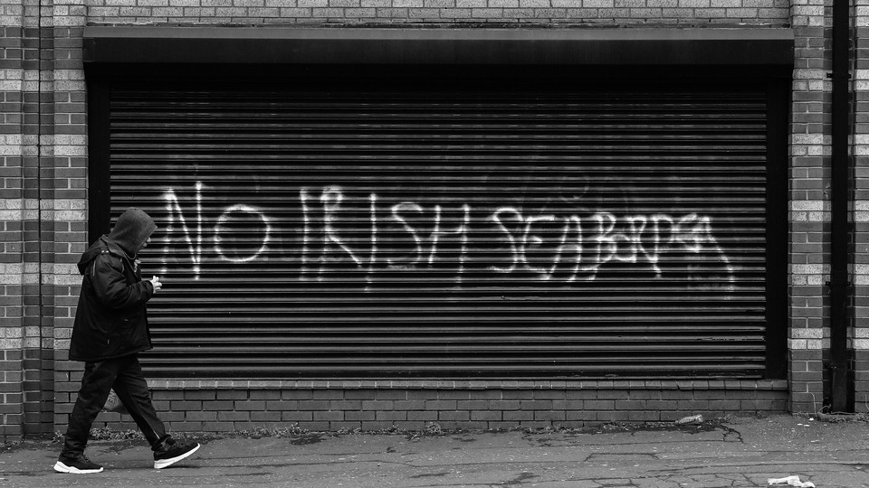 The phrase "No Irish Seaborder" is written on a wall.