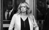 Black-and-white photo of Stormy Daniels leaving a court room