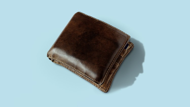 a wallet with a shadow of Biden's face