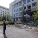 A man takes a photo of ruins in Pripyat, Ukraine.