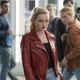 A young woman, played by actor Kathryn Newton, in a red leather jacket