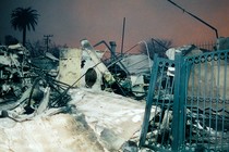 Color photograph of a burned house with melted plastic in Los Angeles
