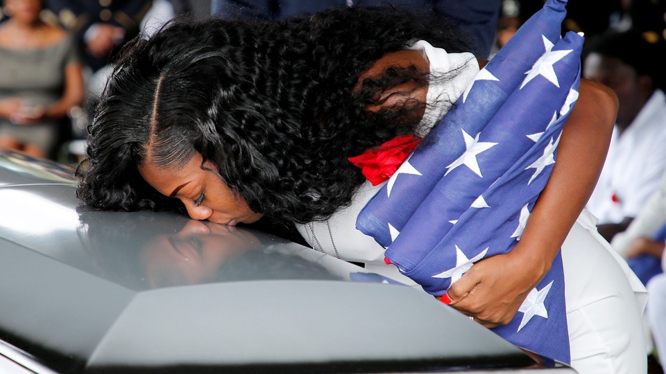 Myeshia Johnson kisses the casket of her husband, Sergeant La David Johnson.