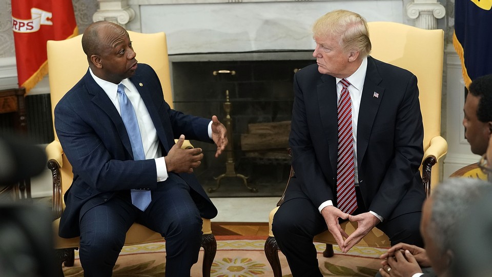 Then-President Donald Trump and Senator Tim Scott in the Oval Office of the White House in February 2018