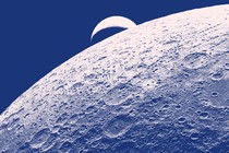 A blue-tined photo showing the Earth setting behind the moon