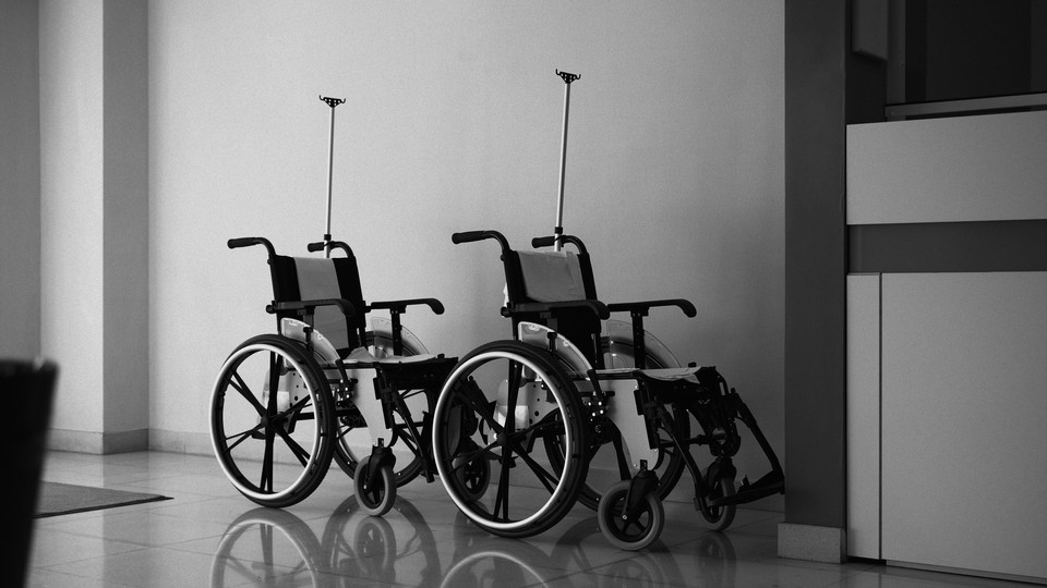 Empty wheelchairs in a health-care setting.