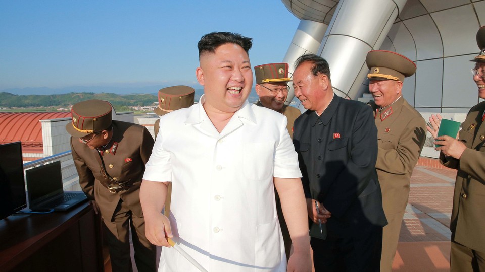 North Korean leader Kim Jong Un reacts to a previous test-fire of a cruise rocket.
