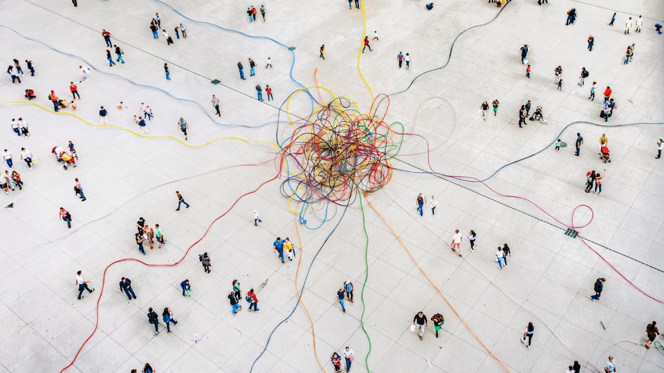 Aerial view of crowd connected by colouful lines