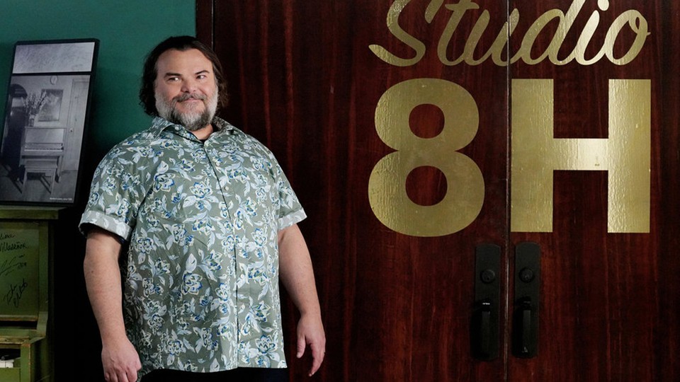Jack Black in front of a Studio 8H sign