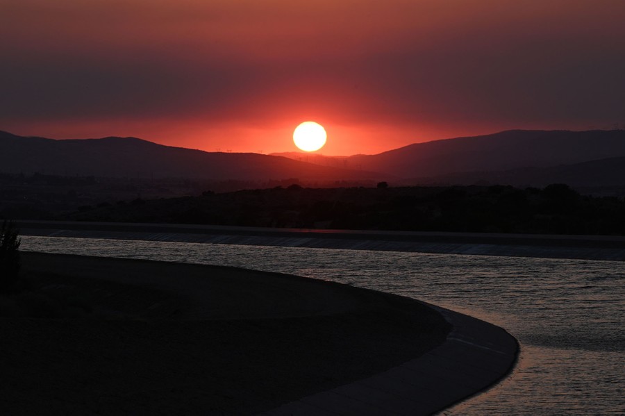 A sunset is seen above the California Aqueduct.