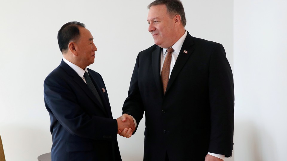 Kim Yong Chol and Mike Pompeo shaking hands