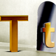 An illustration of a large gold capital "T," next to a smaller gold lowercase "t"