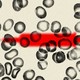 Blood cells superimposed over a hypodermic needle
