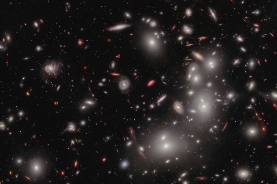 Hundreds of galaxies of varying shapes and sizes fill an image of deep space.