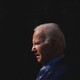 Photo of Joe Biden in silhouette against a black background