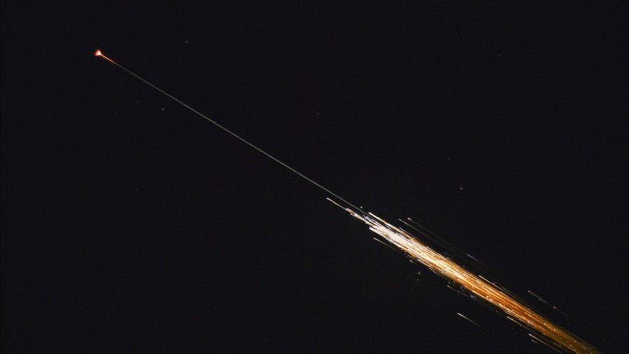 Streaks of light cross the night sky.