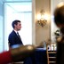 Jared Kushner sits at a table with Donald Trump.
