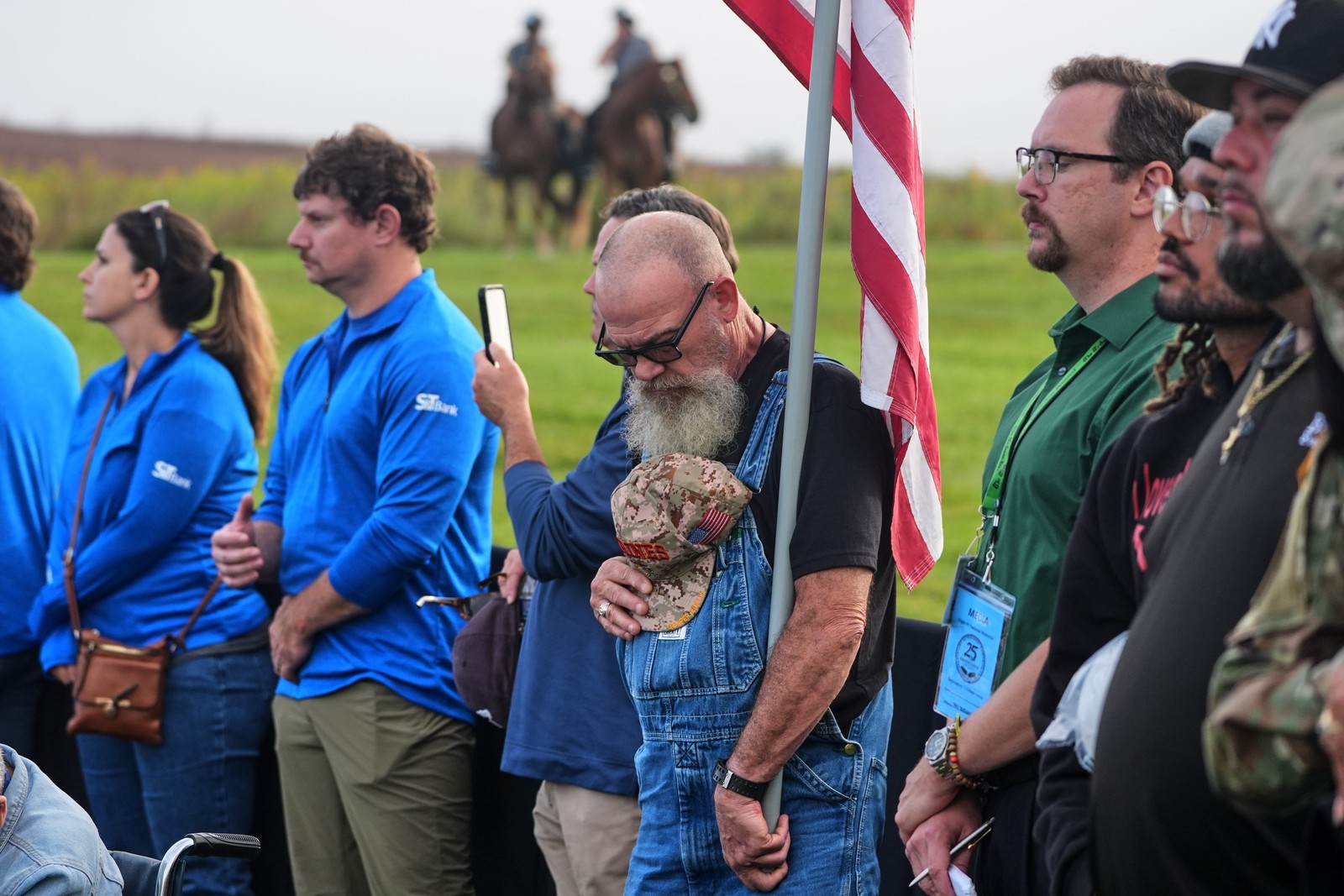 People stand during a memorial ceremony.