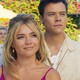 Florence Pugh and Harry Styles smiling softly in "Don't Worry Darling"