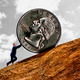 An illustration of a little Trump pushing a giant dollar coin uphill