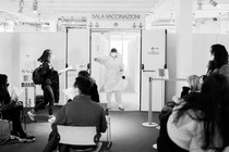 A nurse calls on patients waiting for the AstraZeneca COVID-19 vaccine at the Museum of Science and Technology in Milan, March 22.