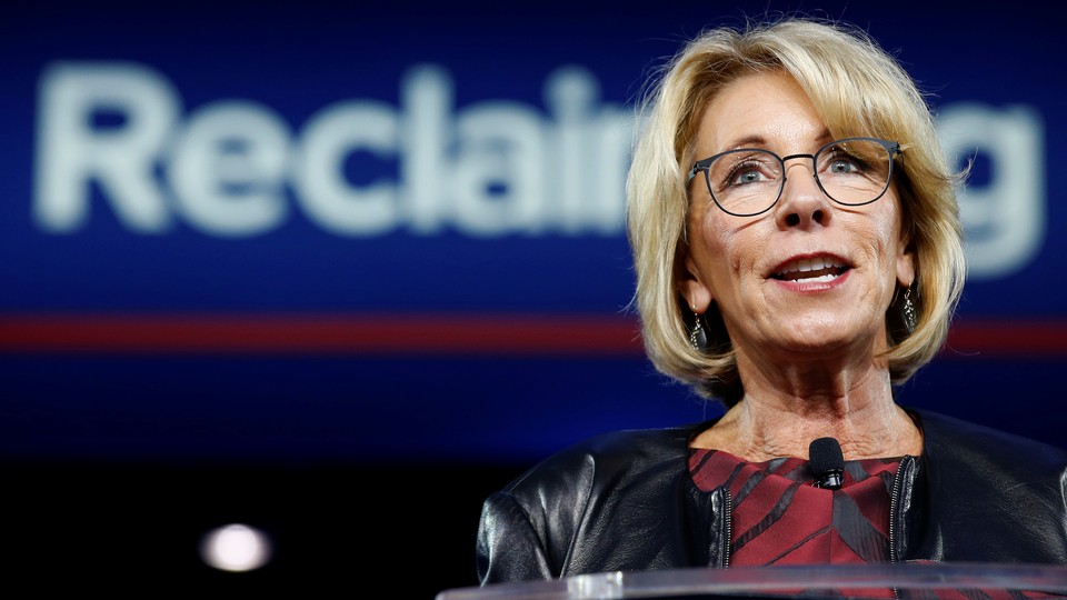 Betsy DeVos speaks at a conference