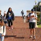 Students walking down steps on campus